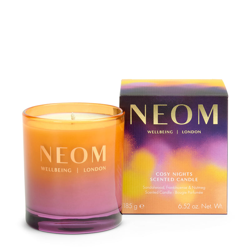 NEOM Cosy Nights scented candle with packaging on a white background