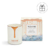 NEOM candle and packaging on a white background