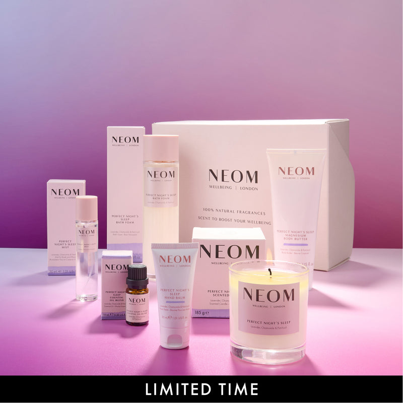 NEOM skincare and candle products on a pink gradient background