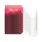 Stack of NEOM skincare products with a white background