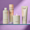 NEOM skincare products including bath foam, lotion, and candle on a purple background