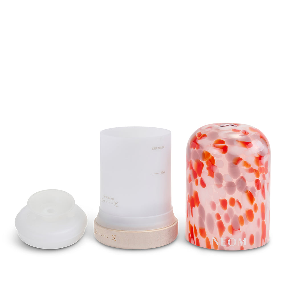 NEOM diffuser parts on a white background