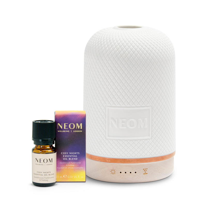 Neom diffuser and essential oil set on a white background