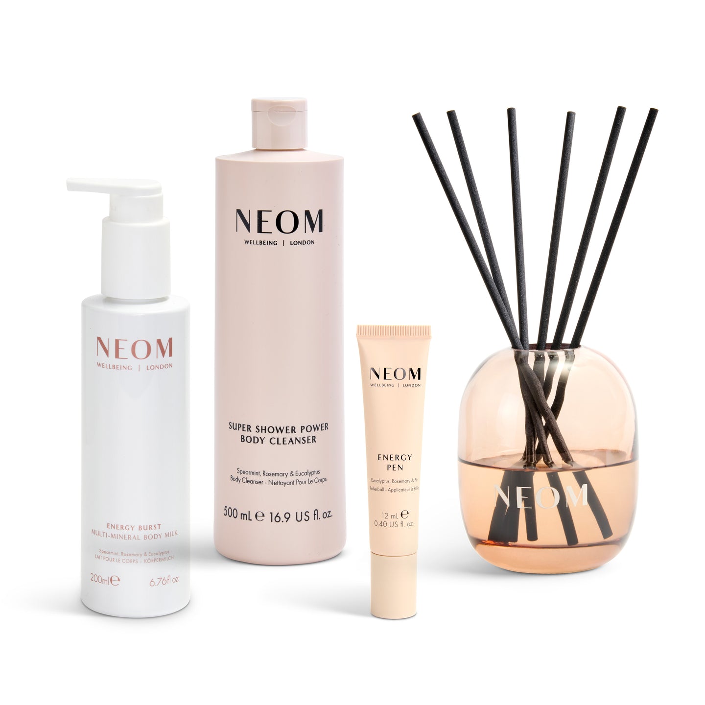 Neom skincare products and diffuser on a white background