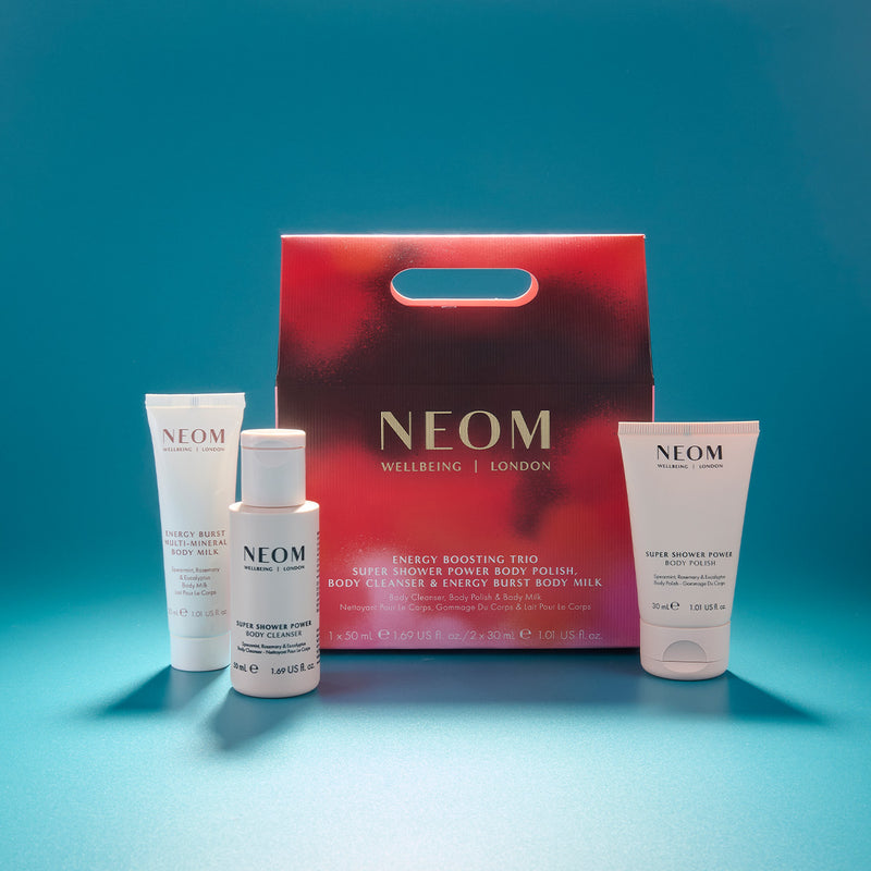 NEOM skincare products including a red box on a blue background