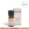NEOM essential oil bottle and packaging on a white background