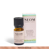 NEOM essential oil bottle and packaging on a white background