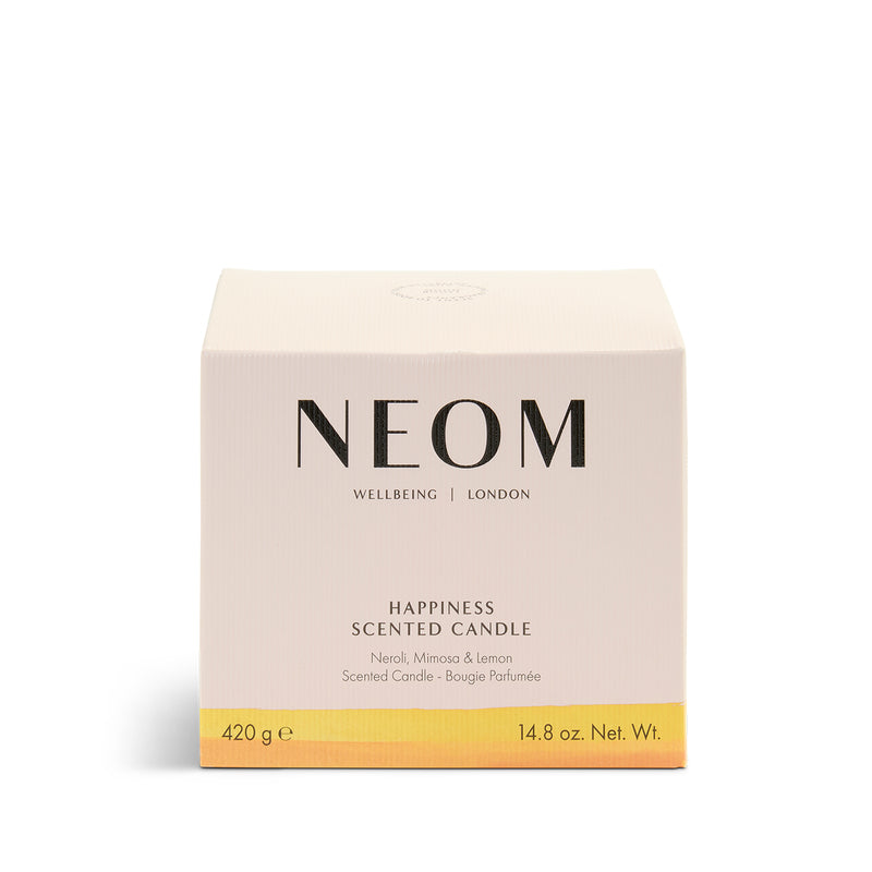 NEOM Happiness 3 Wick candle on a white background
