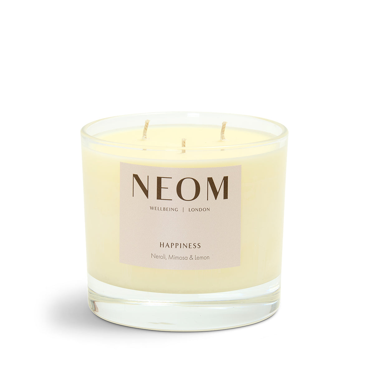 NEOM Happiness 3 Wick candle on a white background