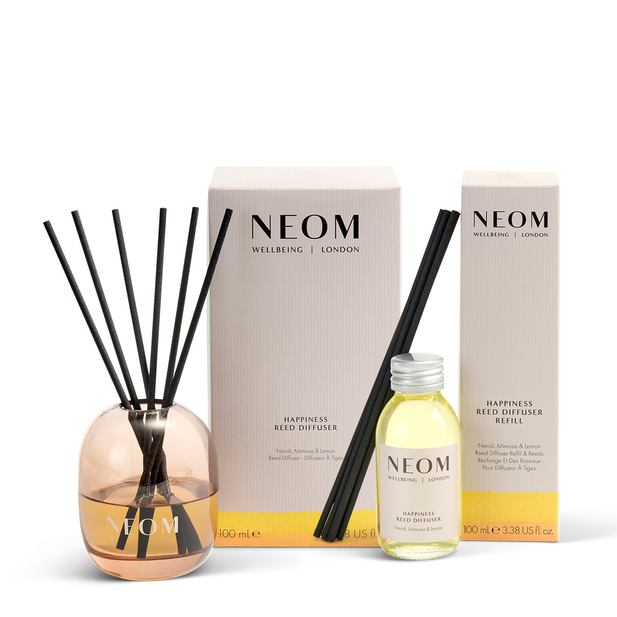 Neom diffuser set with bottle, diffuser, and packaging on a white background