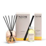 Neom diffuser set with bottle, diffuser, and packaging on a white background