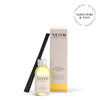 NEOM happiness reed diffuser set with bottle, sticks, and box on a white background