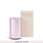 Pink NEOM diffuser and packaging on a white background