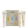 NEOM body butter trio with packaging on a white background