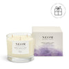 NEOM candle with packaging on a white background
