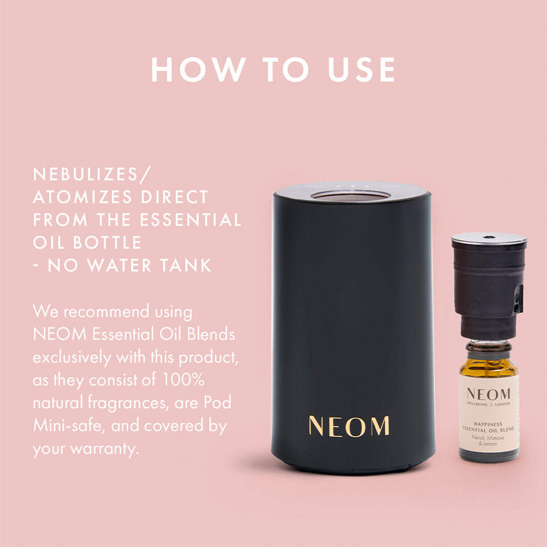 NEOM essential oil diffuser and bottle on a pink background with text on how to use.