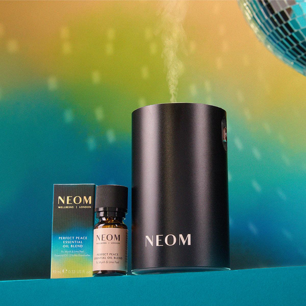 NEOM products including a black cylindrical container, a small bottle, and packaging on a gradient background.