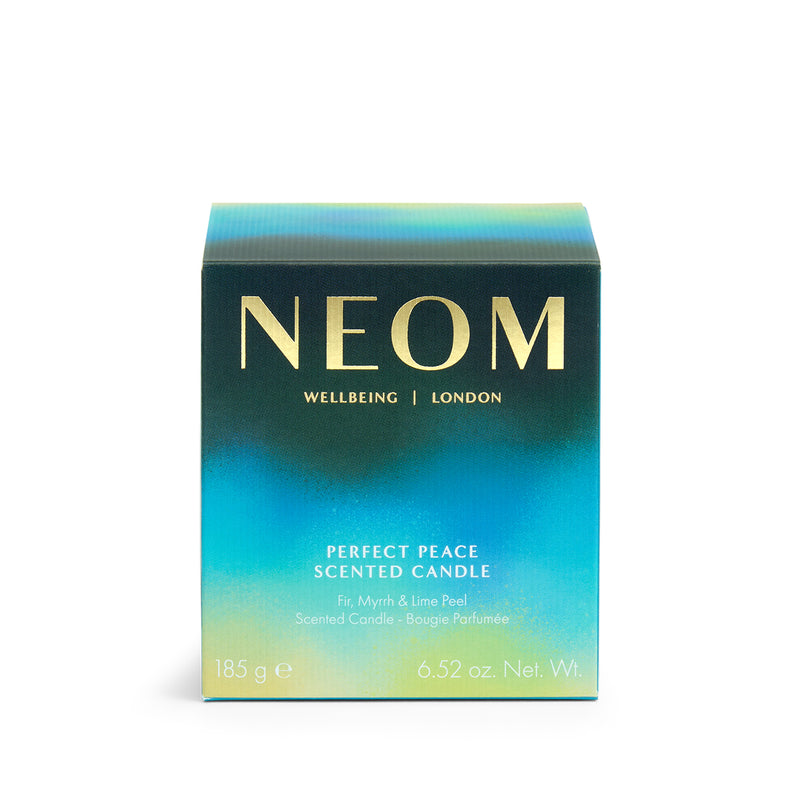 NEOM candle packaging with gradient blue and green design on a white background