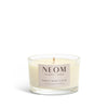 NEOM candle with a white background