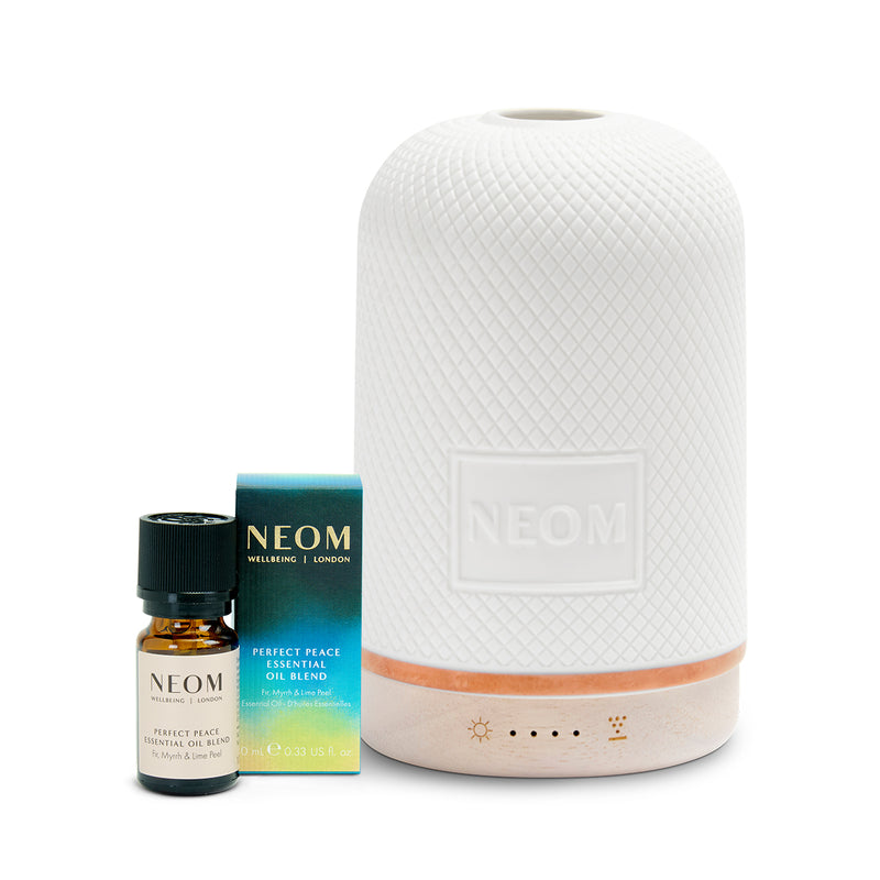 White diffuser with NEOM products on a white background