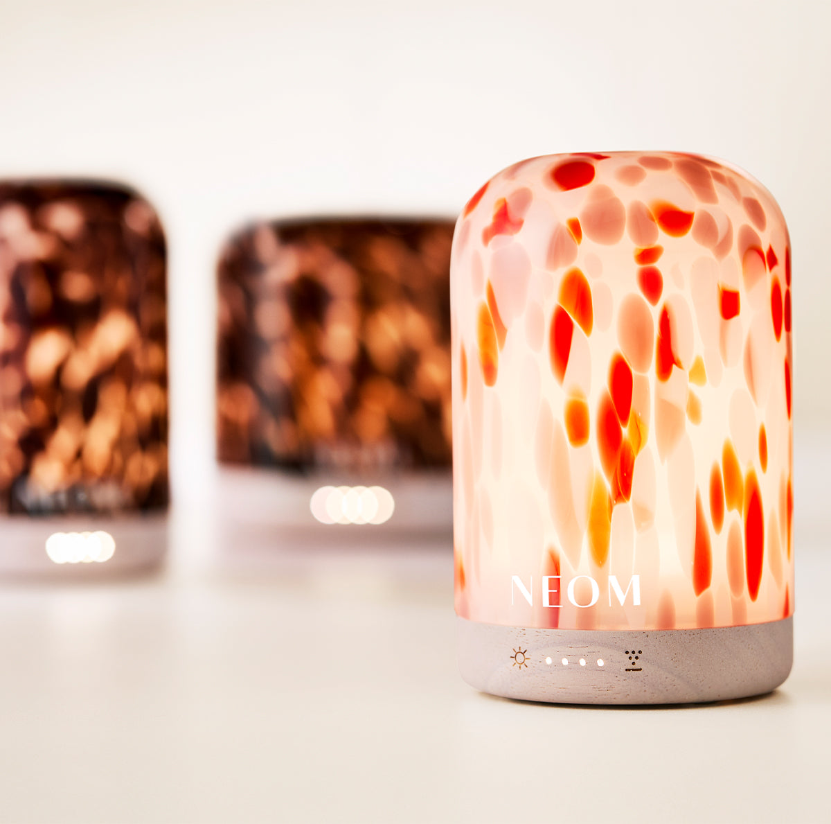 NEOM diffuser with a marbled design on a white background