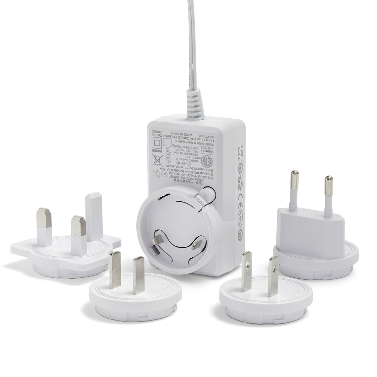 Set of multiple travel adapters on a white background