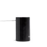 NEOM pod mini diffuser with adapter on a white background