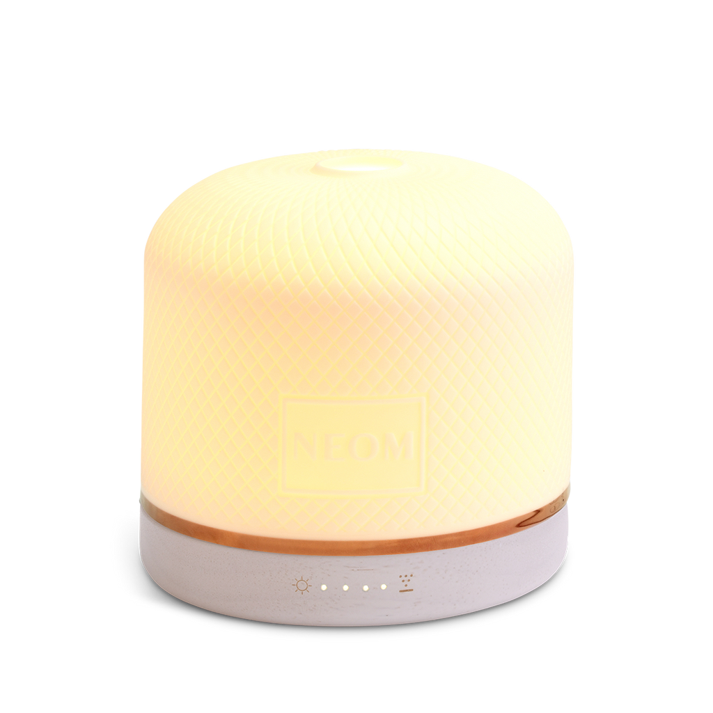 NEOM Pod Luxe essential oil diffuser with warm light for aromatherapy and home fragrance