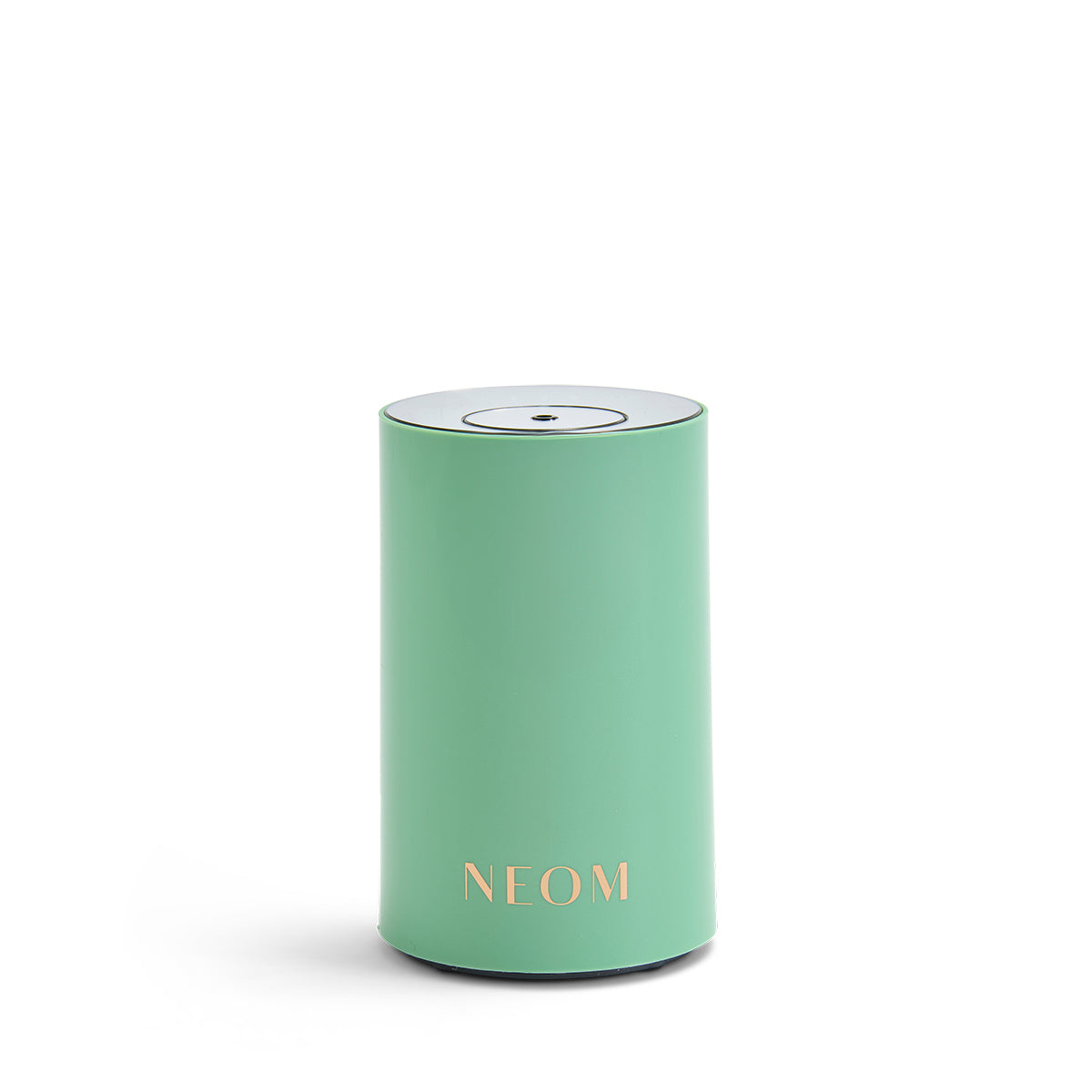 NEOM pod mini in green on a white background