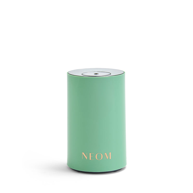 NEOM pod mini in green on a white background