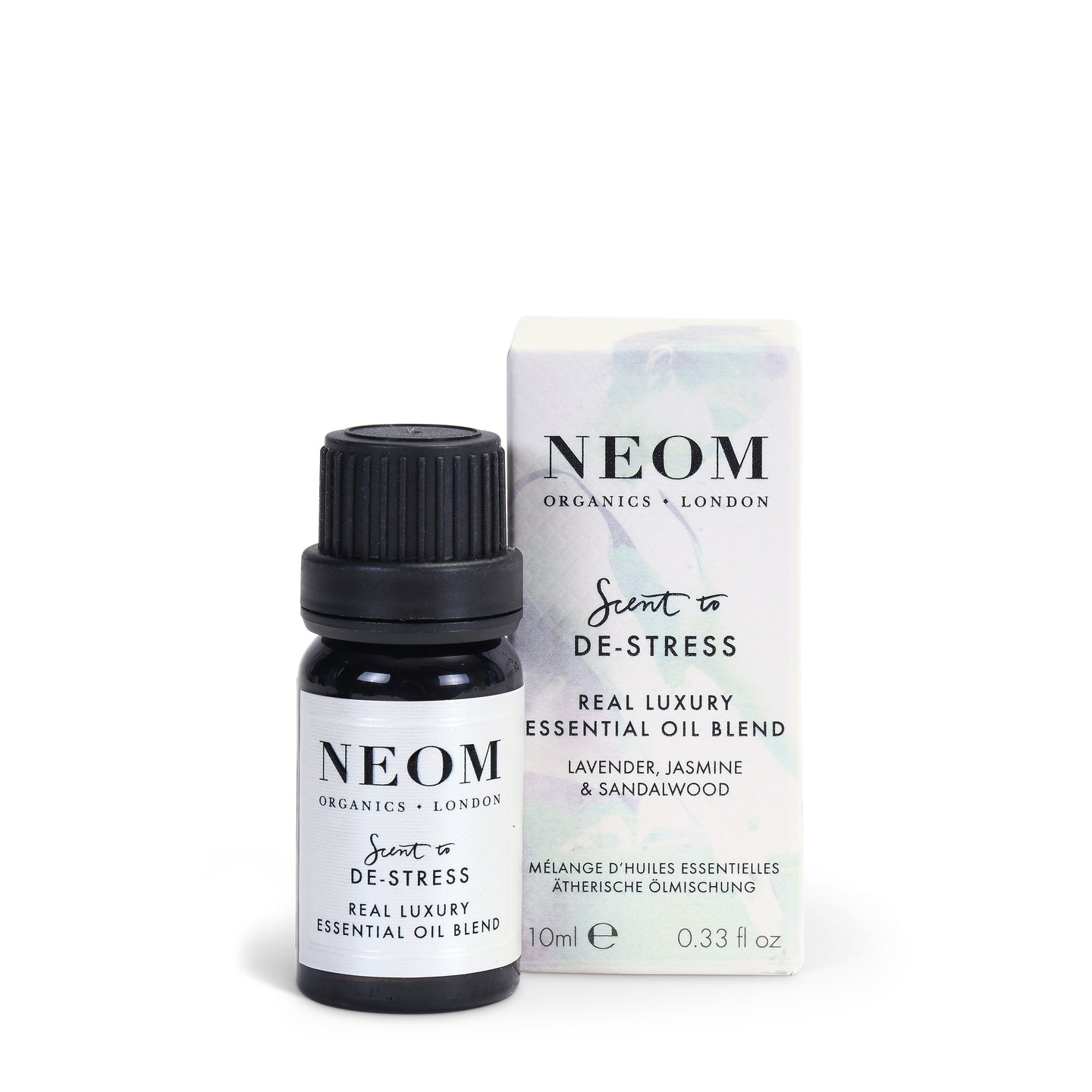 NEOM real luxury essential oil bottle and packaging on a white background