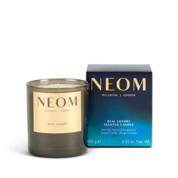 NEOM candle and packaging on a white background