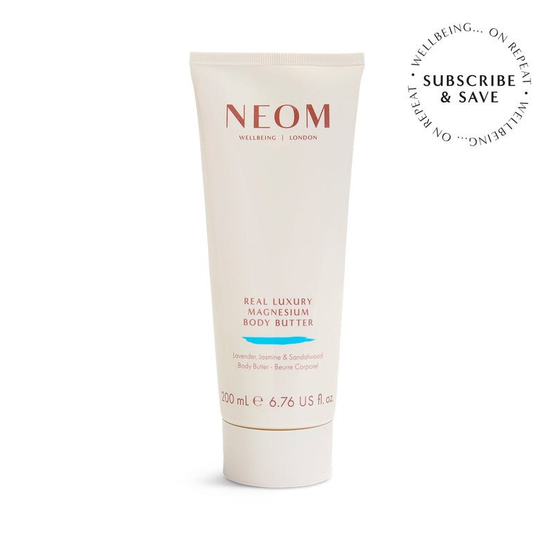 NEOM Real Luxury Magnesium Body Butter tube on a white background