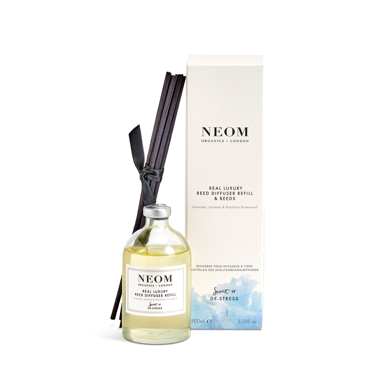 NEOM diffuser refill and reeds set on a white background