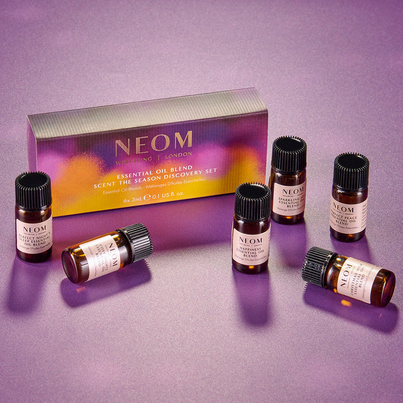 NEOM essential oil blend set on a purple background