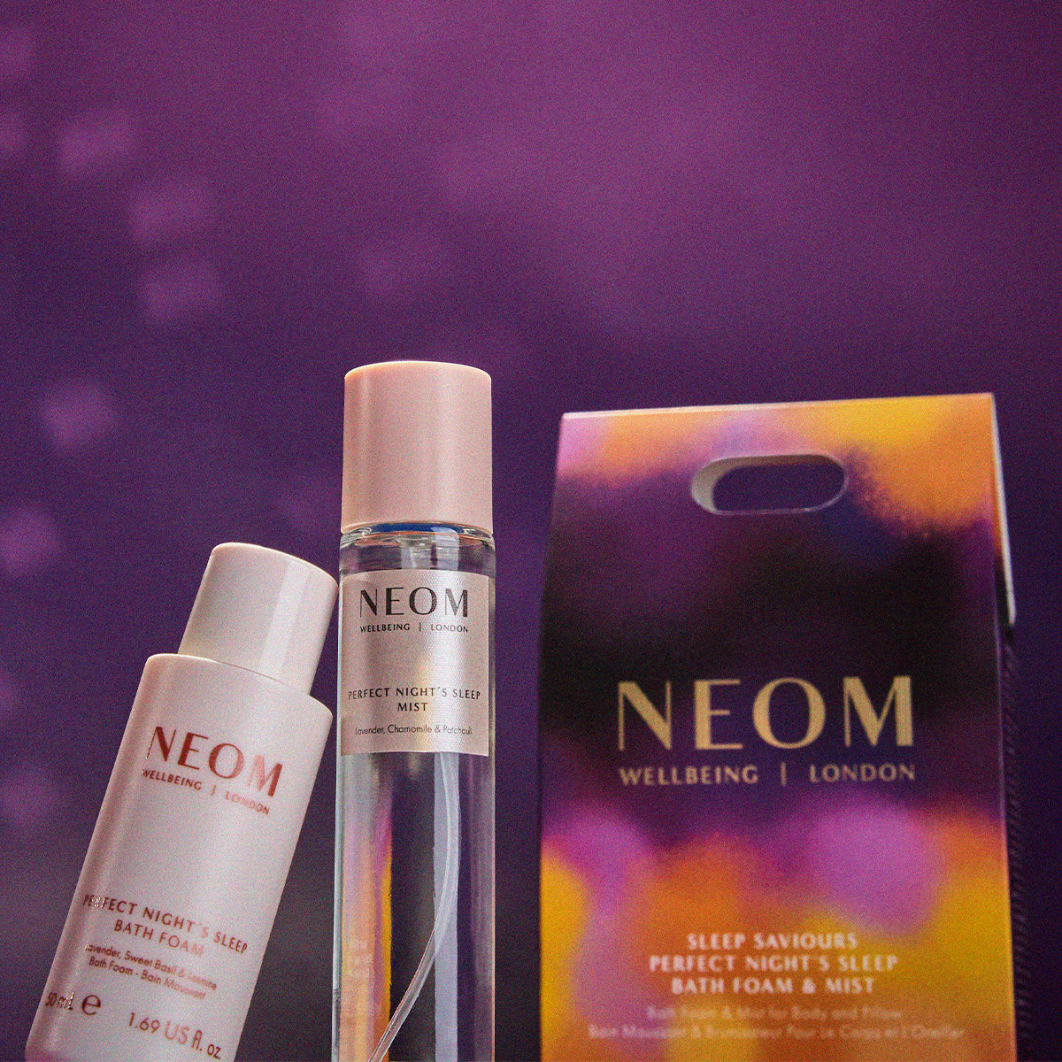 NEOM skincare products on a purple background