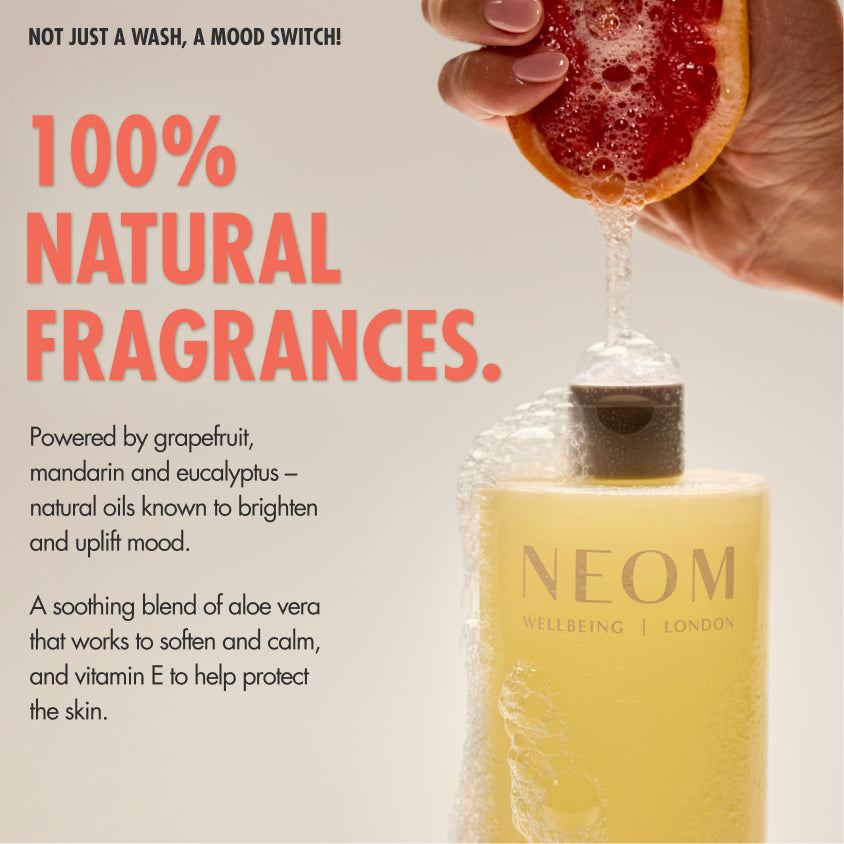 “NEOM Squeeze the Day Body Wash with foam, while a hand squeezes a grapefruit above it. Text reads: ‘Not just a wash, a mood switch! 100% natural fragrances.’ Additional text: ‘Powered by grapefruit, mandarin and eucalyptus – natural oils known to brighten and uplift mood. A soothing blend of aloe vera that works to soften and calm, and vitamin E to help protect the skin.’”