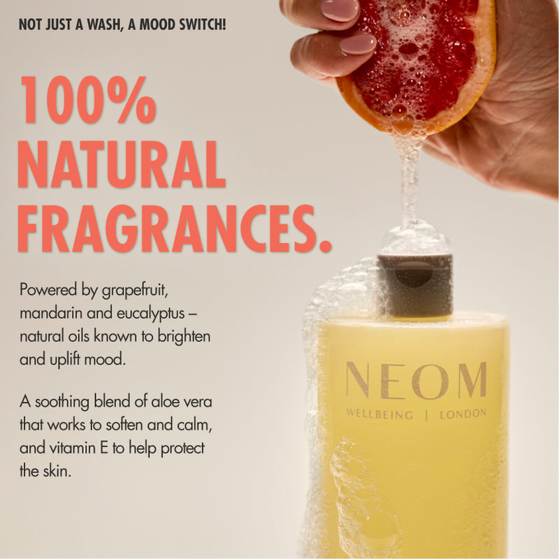 “NEOM Squeeze the Day Body Wash with foam, while a hand squeezes a grapefruit above it. Text reads: ‘Not just a wash, a mood switch! 100% natural fragrances.’ Additional text: ‘Powered by grapefruit, mandarin and eucalyptus – natural oils known to brighten and uplift mood. A soothing blend of aloe vera that works to soften and calm, and vitamin E to help protect the skin.’”