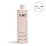 NEOM Super Shower Power Body Cleanser bottle on a white background