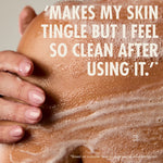 “Close-up of a person’s shoulder covered in soapy lather with a hand resting on the skin. Large text reads: ‘Makes my skin tingle but I feel so clean after using it.’ Small print: ‘*Based on customer reviews on www.neomwellbeing.com.