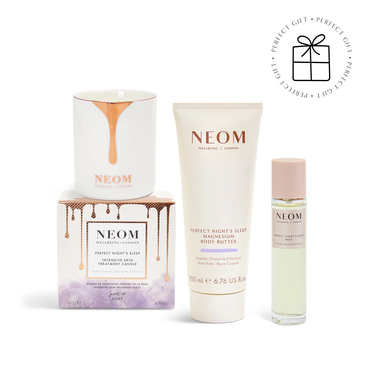 NEOM skincare products including a candle, body butter, and sleep mist on a white background.