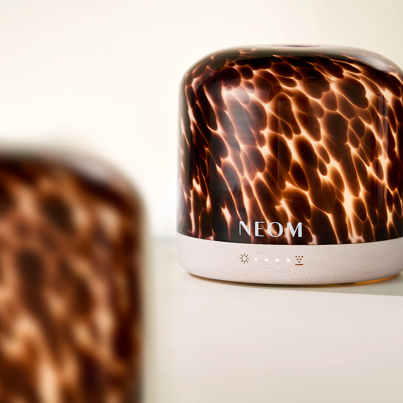 NEOM diffuser with a marble pattern on a light background
