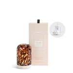 NEOM diffuser on a white background