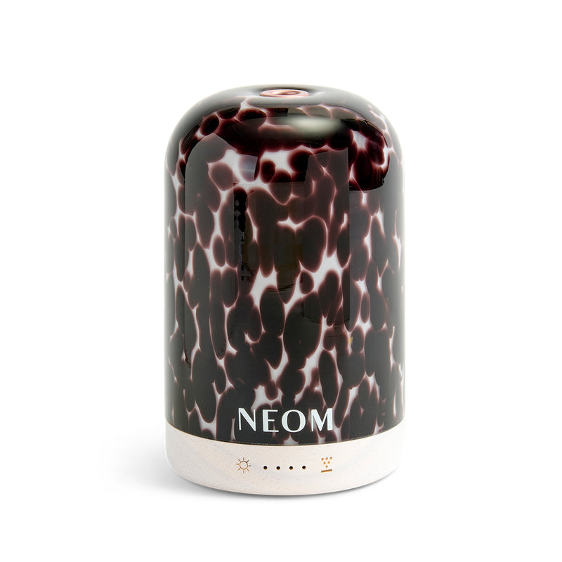 NEOM diffuser with a black and white pattern on a white background