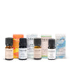 Collection of NEOM essential oil bottles and packaging on a white background