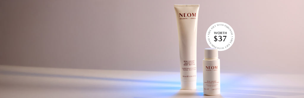 NEOM skincare products on a gradient background