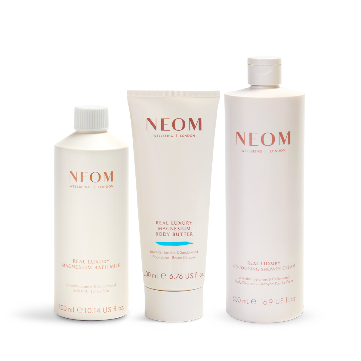 NEOM skincare products including a bath milk, body butter, and cream on a white background