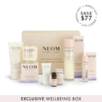 NEOM sleep products including bottles, candles and a box on a white background.