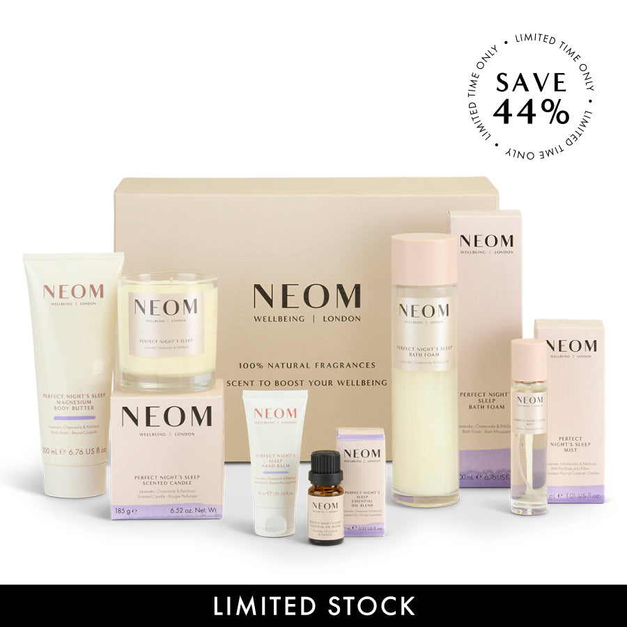 NEOM skincare product set with various bottles and boxes on a white background, featuring a discount offer.