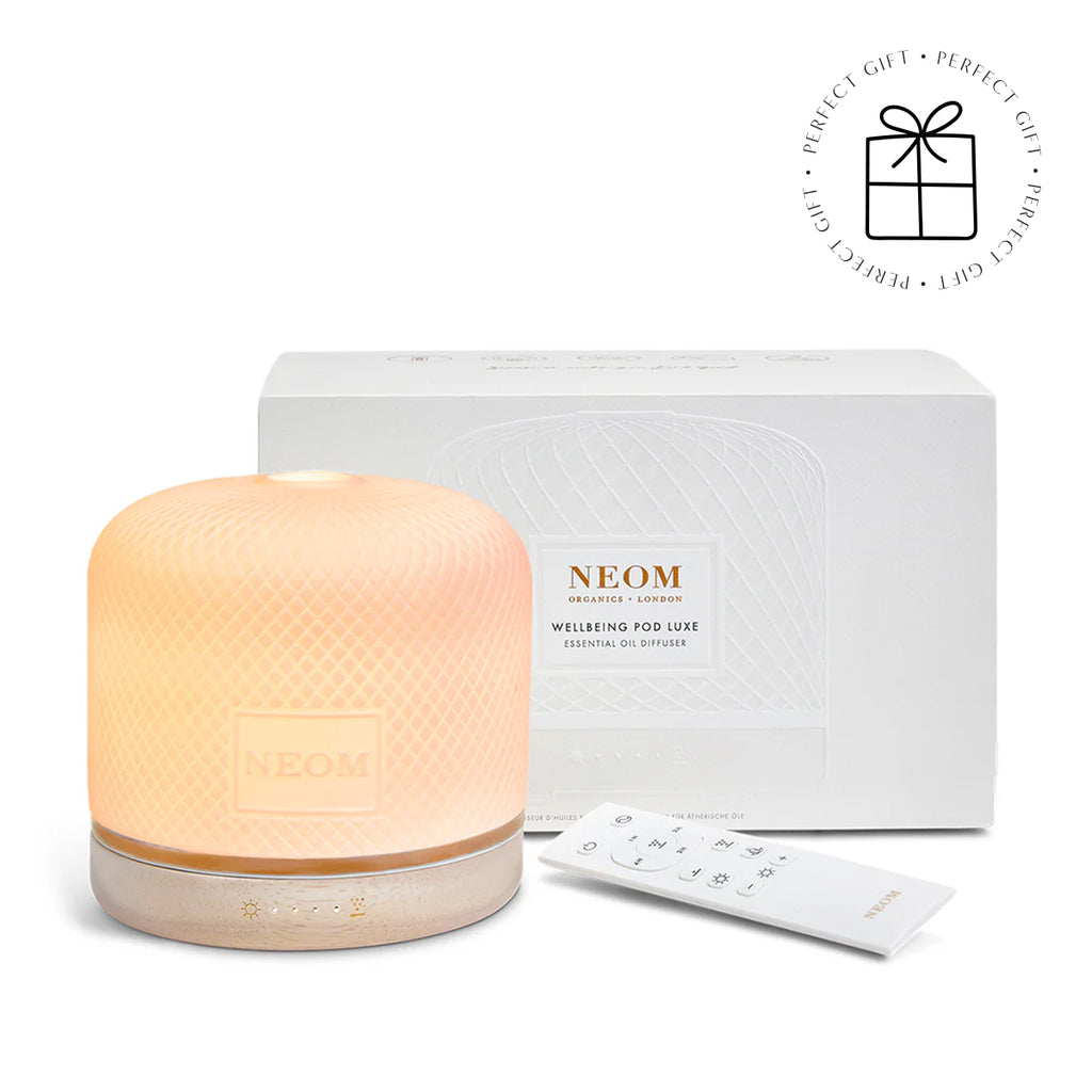 NEOM essential oil diffuser with packaging on a white background